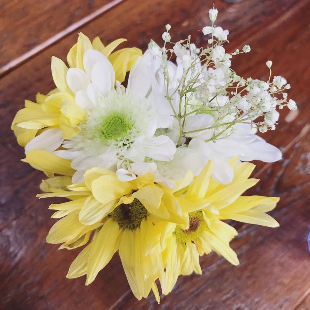 yellow and white flowers with baby's breath